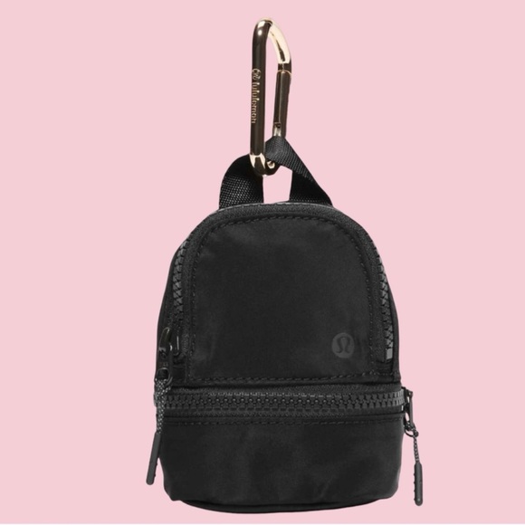 lululemon athletica Handbags - NWOT! LULU-LEMON MINY BACKPACK BLACK WITH GOLD ZIPPER & CARBINU IN GOLD W/ NAME.